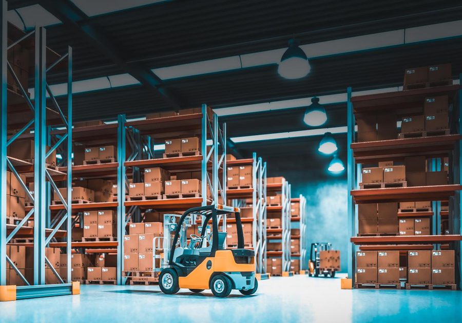A forklift working between tall warehouse racks