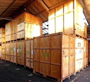 Wooden export crates stacked in a packing area