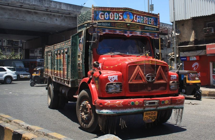 A loaded goods truck on a city road in India